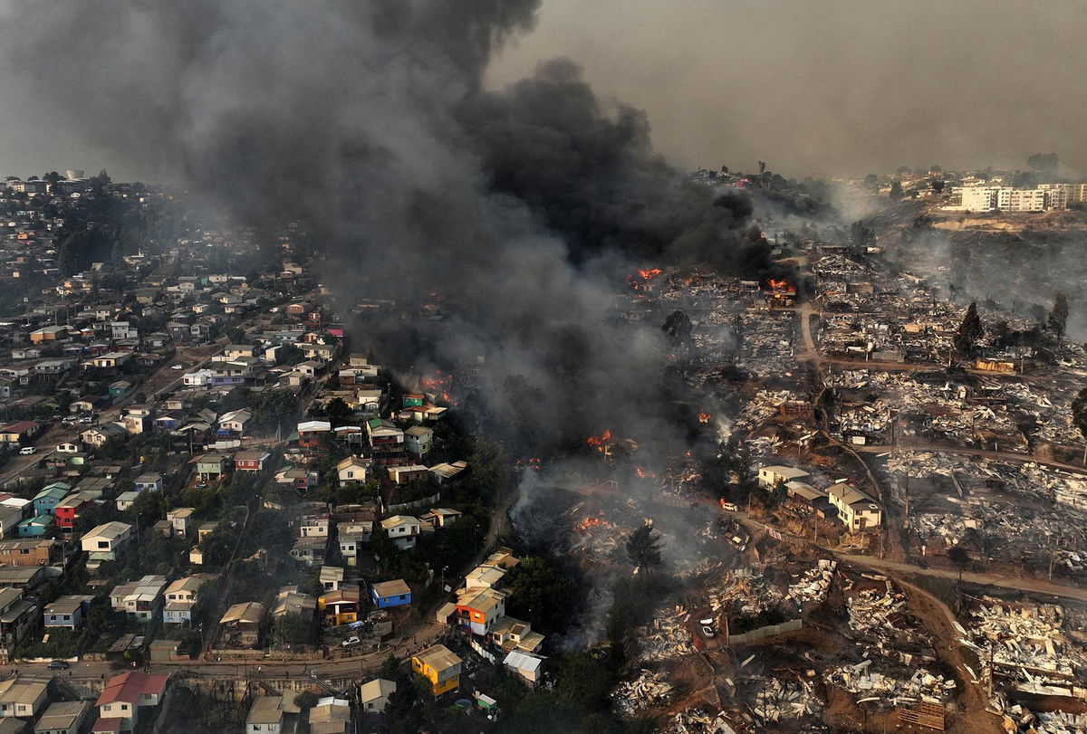 <i>Esteban Felix/AP</i><br/>A view of neighborhoods burned during forest fires in Viña del Mar