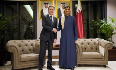 U.S. Secretary of State Antony Blinken shakes hands with Qatar's Prime Minister and Foreign Affairs Minister Mohammed Bin Abdulrahman Al Thani