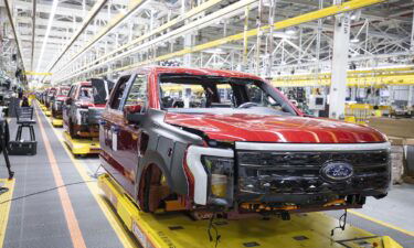 Ford F-150 Lightning electric pickup trucks sit on the production line in Dearborn