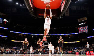 Tristan Thompson #13 of the Cleveland Cavaliers scores over the Atlanta Hawks during the first half at State Farm Arena on January 20