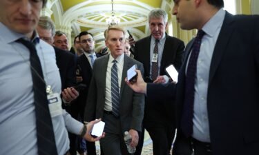 Sen. James Lankford talks to reporters as he makes his way to a meeting at the US Capitol on February 5