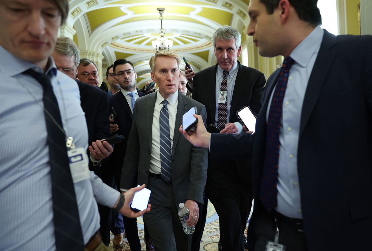 <i>Kevin Dietsch/Getty Images</i><br/>Sen. James Lankford talks to reporters as he makes his way to a meeting at the US Capitol on February 5