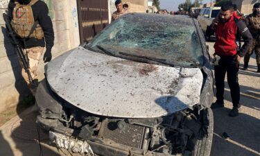 Shell casings lie at the site of a US airstrike in Al Qaim