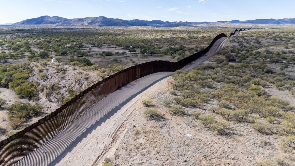 <i>Valerie Macon/AFP/Getty Images</i><br/>This aerial picture taken in December  2023 shows the US-Mexico border wall in Sasabe