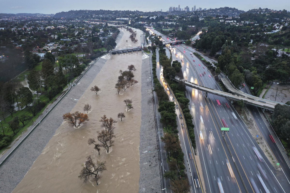 <i>Mario Tama/Getty Images</i><br/>The Los Angeles River swollen by storm runoff on February 5 in Los Angeles.