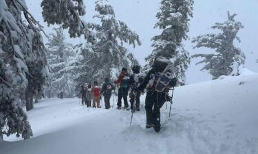 Rescuers hike to recover three Mount Baldy hikers who also went missing on Sunday.