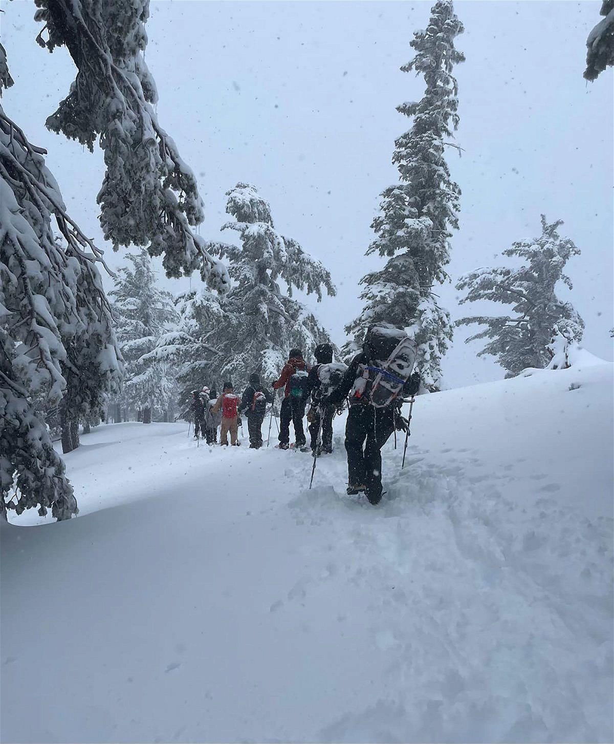 <i>From Sierra Madre Search and Rescue Team</i><br/>Rescuers hike to recover three Mount Baldy hikers who also went missing on Sunday.