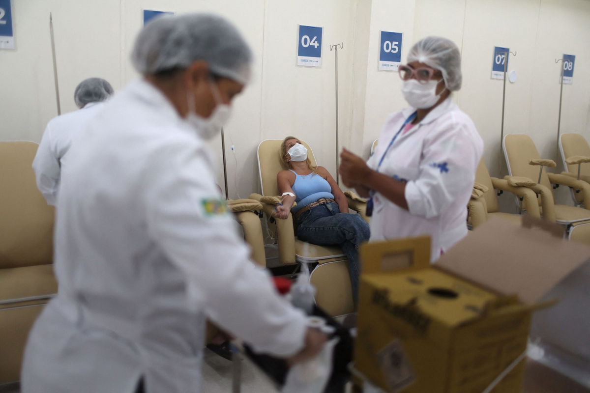 <i>Pilar Olivares/Reuters</i><br/>Nurses attend to patients at a dengue emergency medical care unit in Rio de Janeiro