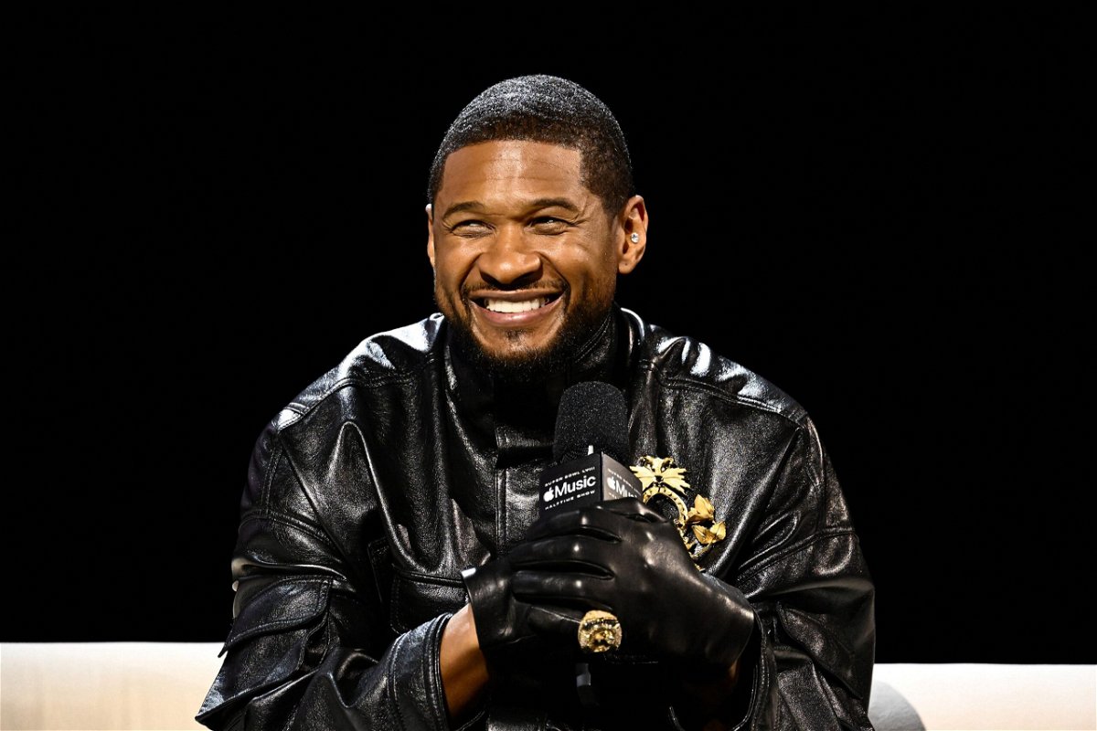 <i>Patrick T. Fallon/AFP/Getty Images</i><br/>Usher speaks during a press event ahead of Super Bowl LVIII in Las Vegas on Thursday.