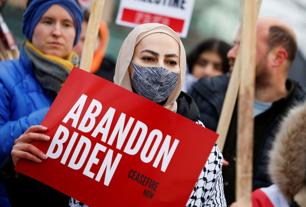 <i>Rebecca Cook/Reuters</i><br/>Protestors rally for a Cease Fire in Gaza outside a UAW union hall during a visit by President Joe Biden in Warren