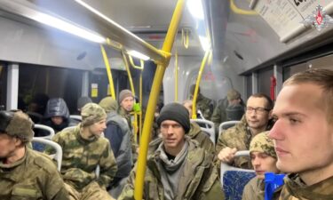 A still image from a video released by the Russian Defense Ministry on February 8 shows what it said were freed Russian service personnel in a bus following the latest prisoner exchange.