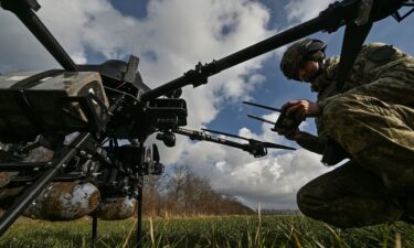 A Ukrainian serviceman checks a Vampire unmanned aerial vehicle before flying near a front line