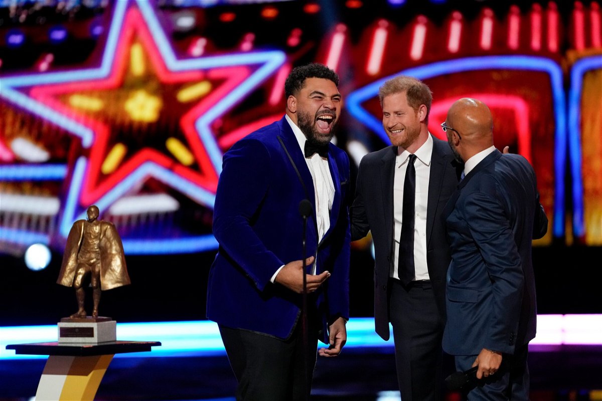 <i>David J. Phillip/AP</i><br/>Prince Harry presents Cameron Heyward (left) with the NFL Man of the Year award.