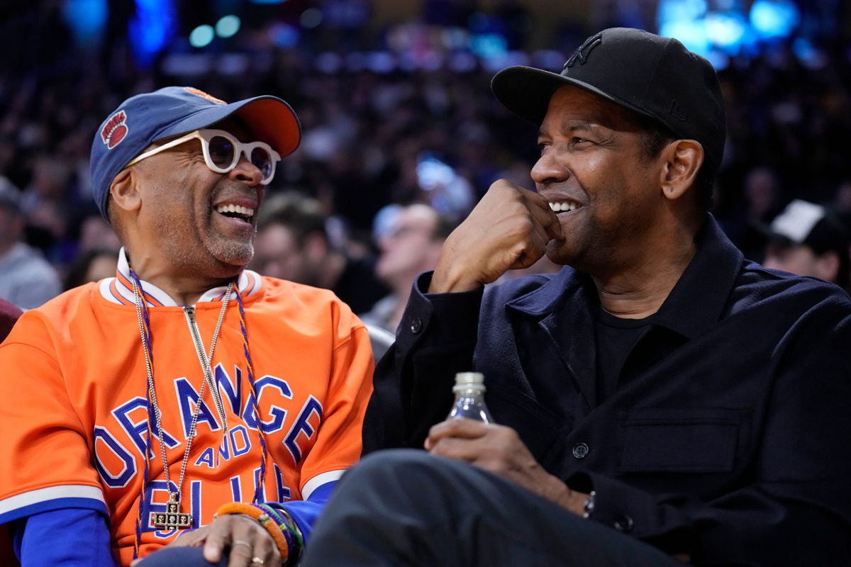 <i>Marcio Jose Sanchez/AP</i><br/>Spike Lee and Denzel Washington during the first half of an NBA basketball game between the Los Angeles Lakers and the New York Knicks in 2023.