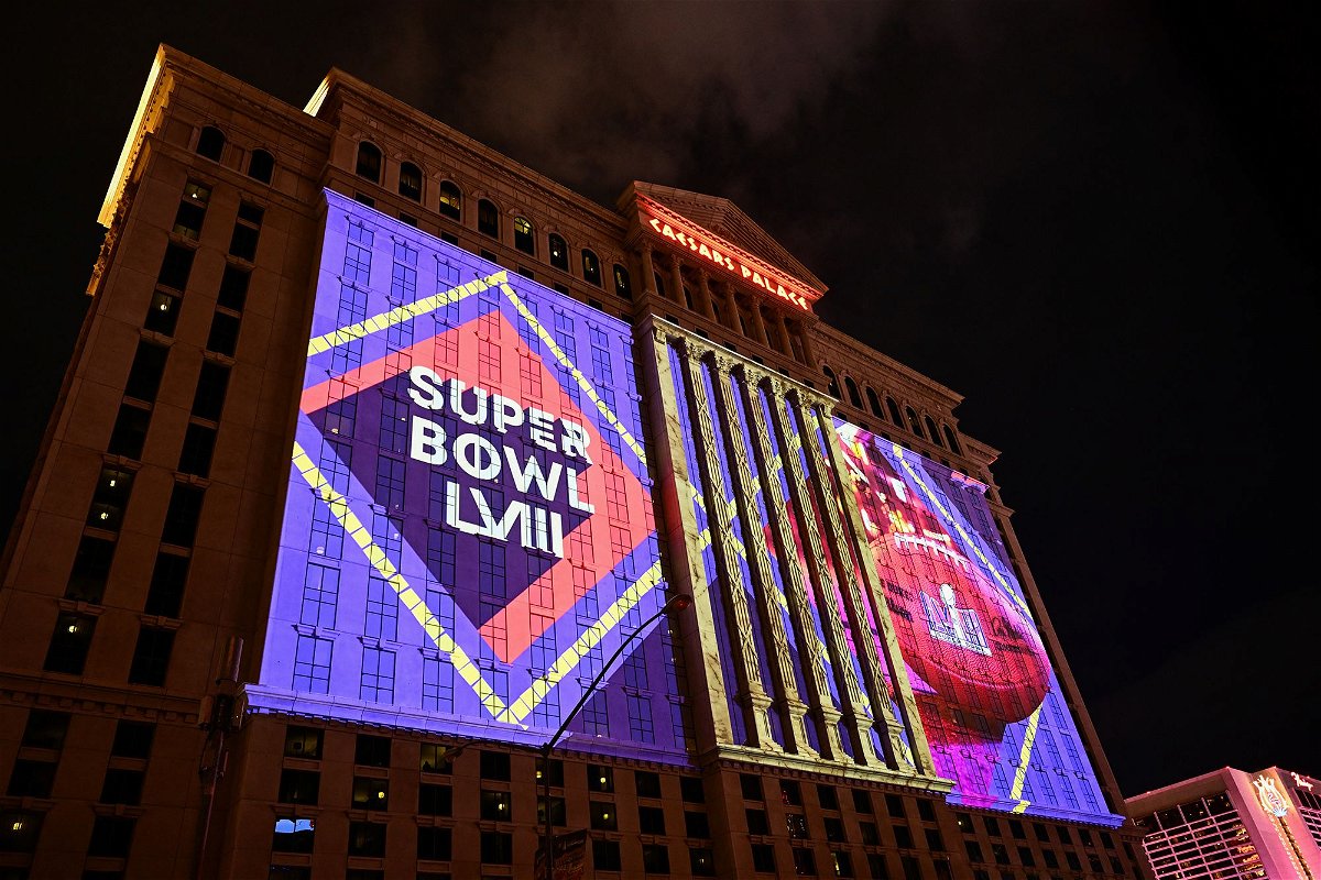 <i>Patrick T. Fallon/AFP/Getty Images</i><br/>NFL Super Bowl LVIII football logos are projected on the side of Caesars Palace Las Vegas Hotel and Casino ahead of Sunday's game.