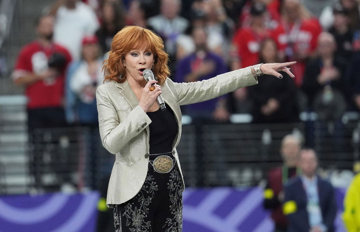 <i>Timothy A. Clary/AFP via Getty Images</i><br/>Reba McEntire sings the National Anthem ahead of the Super Bowl at Allegiant Stadium in Las Vegas on Sunday.