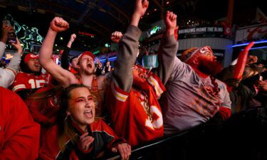 Kansas City Chiefs fans celebrate as their team defeats the San Francisco 49ers in Super Bowl LVIII during the Red Kingdom Block Party at the Power and Light District on February 11
