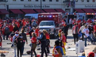 People run from danger Wednesday near the Kansas City Chiefs Super Bowl victory parade route.