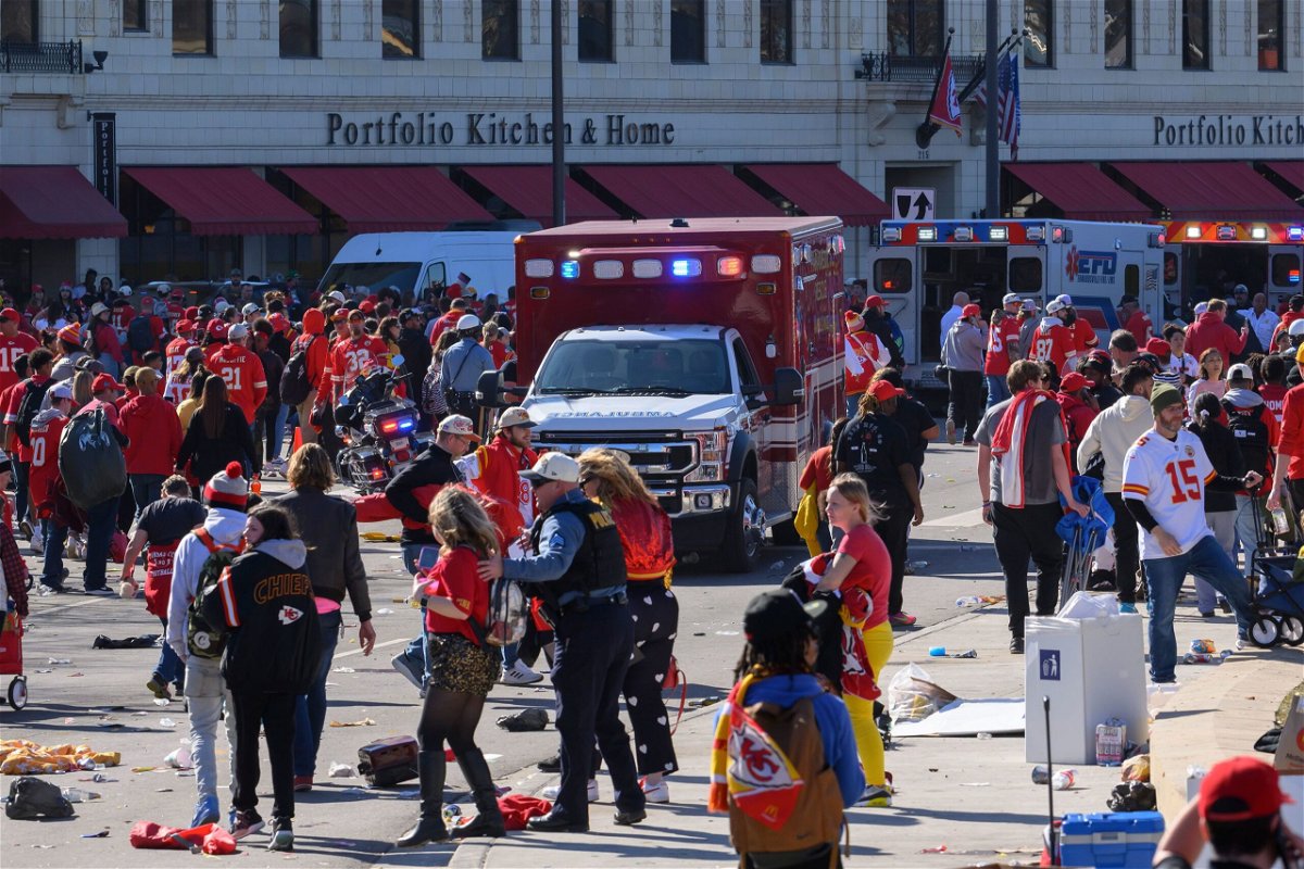 <i>Andrew Caballero-Reynolds/AFP/Getty Images</i><br/>People run from danger Wednesday near the Kansas City Chiefs Super Bowl victory parade route.