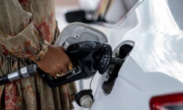 Pam Milligan fills up gas at a Circle K gas station at Osborn and 3rd streets in Phoenix on Feb. 1
