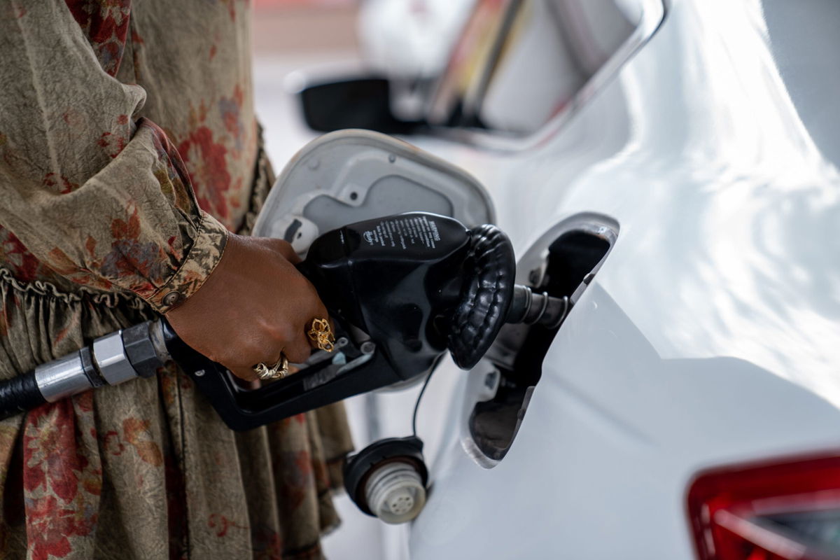 <i>Joel Angel Juarez/The Republic/USA Today Network</i><br/>Pam Milligan fills up gas at a Circle K gas station at Osborn and 3rd streets in Phoenix on Feb. 1