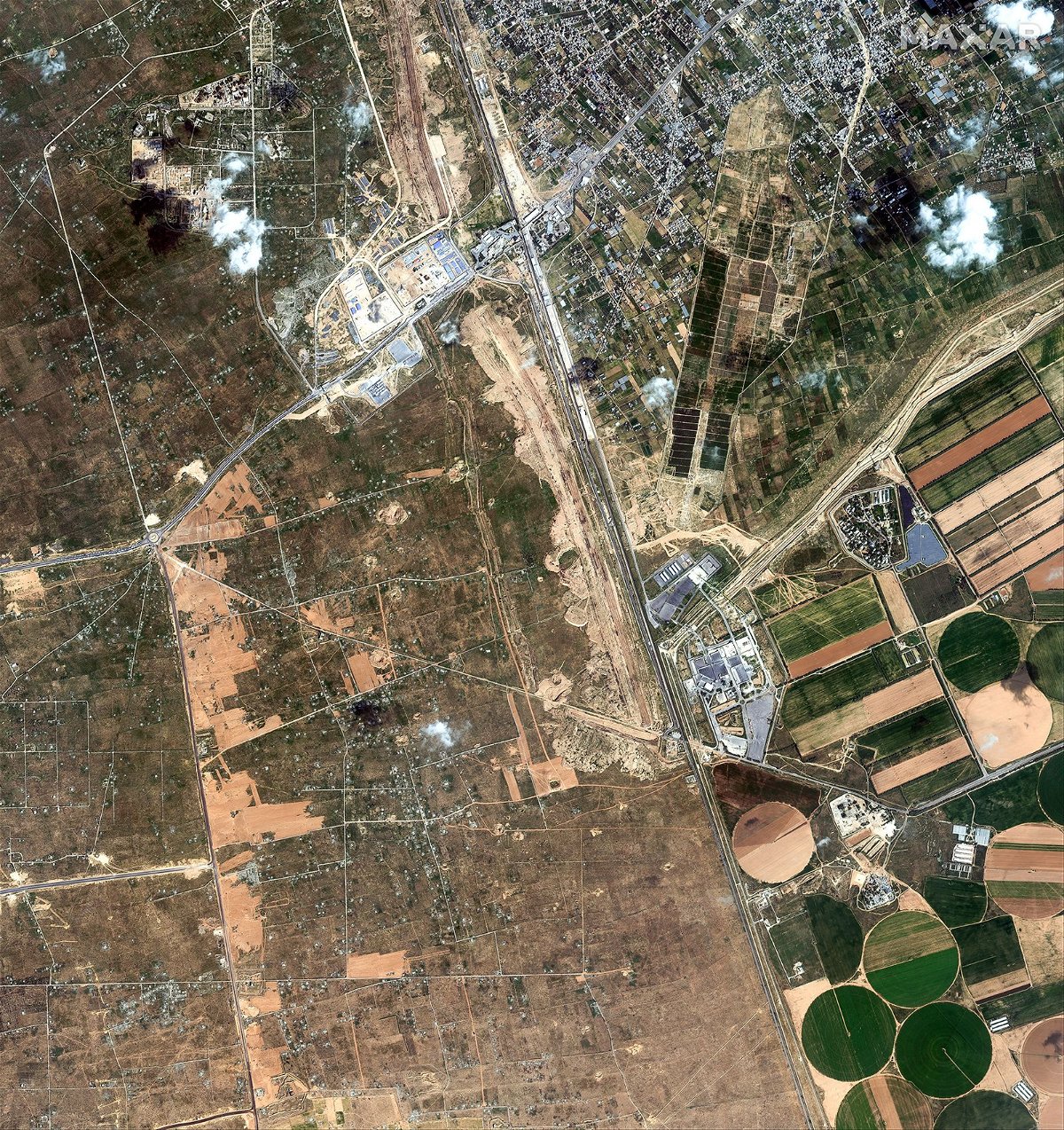 <i>Maxar Technologies</i><br/>This satellite image from Maxar Technologies shows Egypt building a miles-wide buffer zone and border wall along its border with Gaza.