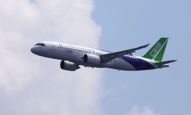 The C919 conducts a flyby at the Singapore Airshow at Changi Exhibition Centre on February 18