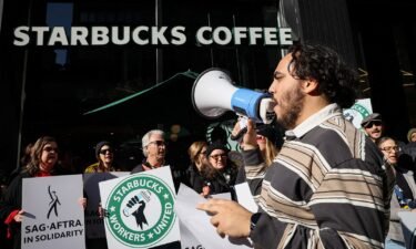 Members of the Starbucks Workers Union and other labor organization picket and hold a rally outside a company owned Starbucks store in New York City