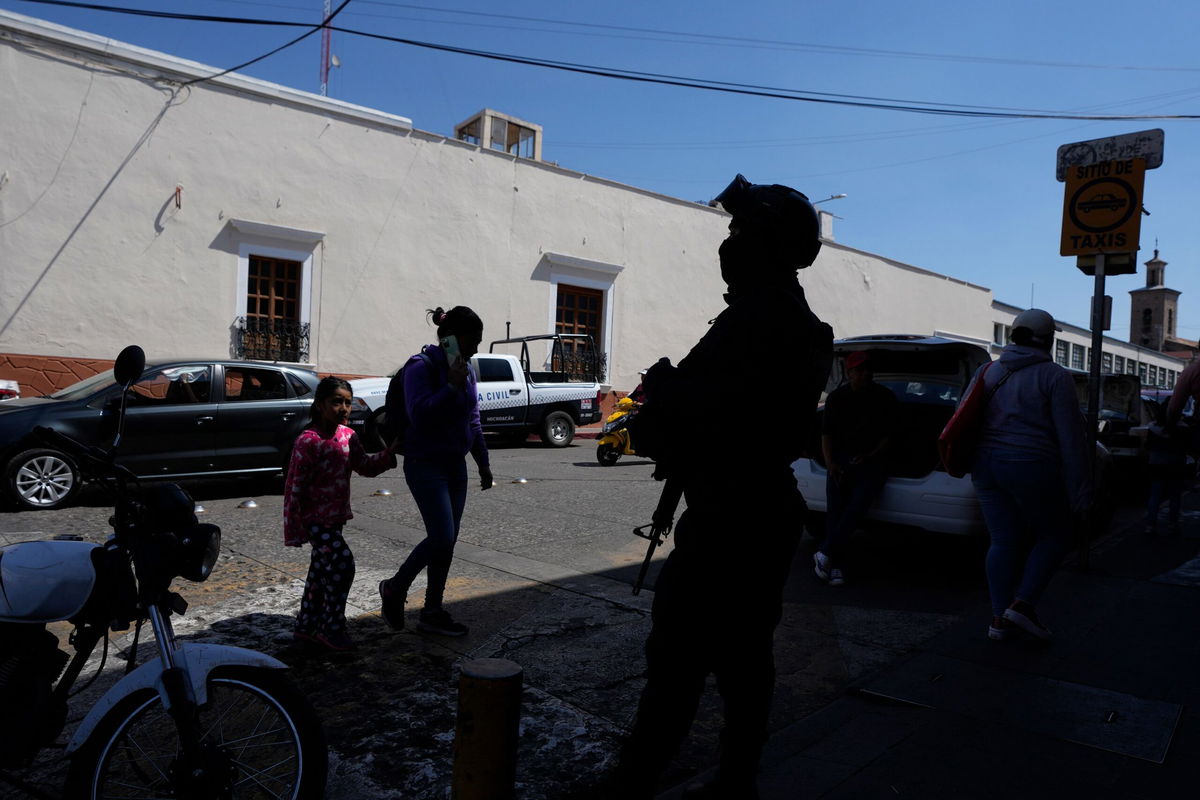 <i>Fernando Llano/AP via CNN Newsource</i><br/>A municipal police officer stands guard in Maravatio