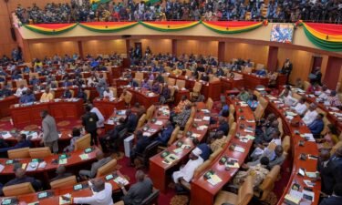 Parliamentarians and members of the public listen as Ghanaian President Nana Akufo-Addo delivers his annual state of the nation address in March 2022.