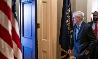 Senate Minority Leader Mitch McConnell departs the Senate chamber on February 28 in Washington