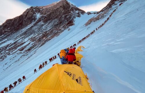 This photograph from 2021 shows mountaineers lined up as they climb a slope during their ascent to summit Mount Everest.
