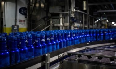 Bottles of Bud Light beer move along a conveyor at an Anheuser-Busch InBev facility in St. Louis