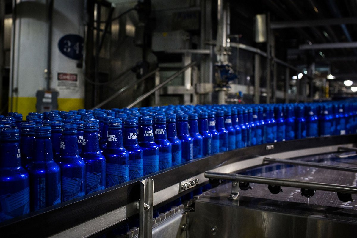 <i>Alex Flynn/Bloomberg/Getty Images via CNN Newsource</i><br/>Bottles of Bud Light beer move along a conveyor at an Anheuser-Busch InBev facility in St. Louis