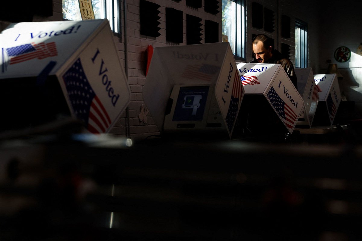 <i>Julia Nikhinson/AFP/Getty Images via CNN Newsource</i><br/>A man votes at the WL Stephens Aquatic Center in Charleston