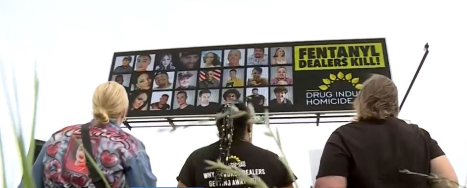 <i>KOVR via CNN Newsource</i><br/>A sign was placed high above Interstate 5 near Bayou Way to raise awareness of the increasing number of deaths due to fentanyl poisoning.