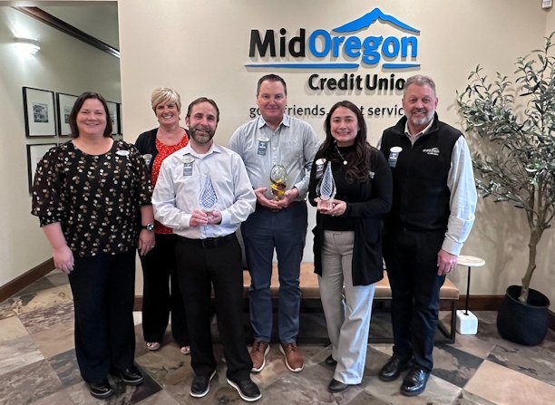 	Mid Oregon executive team poses with three Raddon Crystal Awards The credit union has received three Crystal Awards since 2020.  (Pictured left from right:  Kari Joel, VP Human Resources; Dawn Morrison, VP Member Experience; Jeff Sanders, VP Information Technology; Kevin Cole, President and CEO; Sarah Hix, VP Finance; Kyle Frick, VP Marketing and Community Relations).  