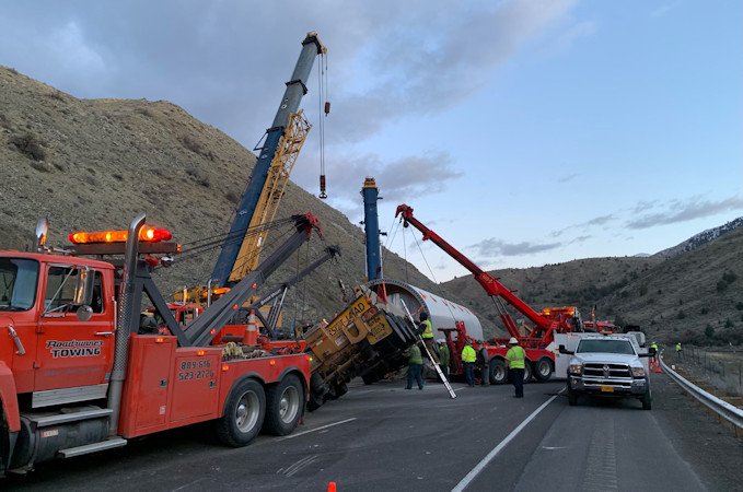 Crews work to remove large wind turbine tower section on truck that crashed on Interstate 84 on Wednesday