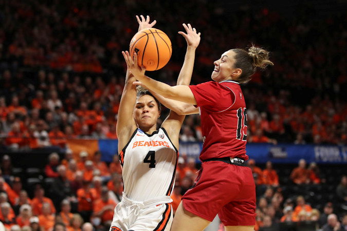 Eastern Washington guard Jamie Loera (15) drives to the basket as Oregon State guard Donovyn Hunter (4) defends during the first half of a first-round college basketball game in the women's NCAA Tournament in Corvallis on Friday.