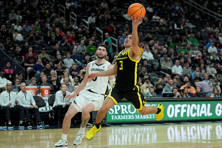 Oregon guard Jackson Shelstad (3) shoots over Colorado guard Luke O'Brien (0) during the first half of the championship of the Pac-12 tournament in Las Vegas.