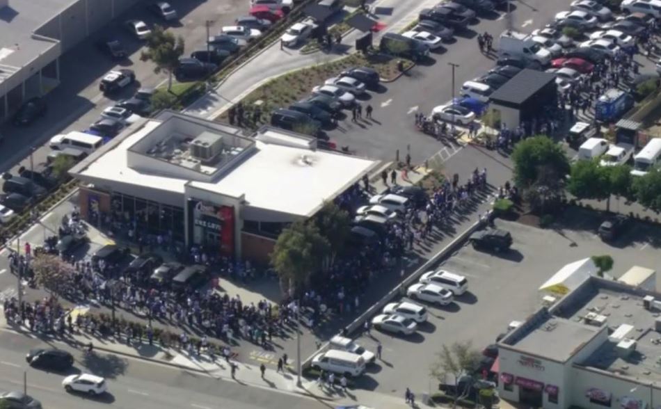 <i>KCAL via CNN Newsource</i><br/>Hundreds lined up at an Alhambra Raising Cane's on March 27 for their chance to be served by the Dodgers' Mookie Betts.