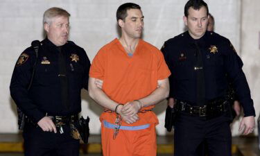 Convicted murderer Scott Peterson is escorted from jail on March 17