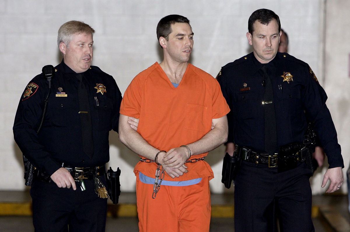 <i>Justin Sullivan/Getty Images via CNN Newsource</i><br/>Convicted murderer Scott Peterson is escorted from jail on March 17