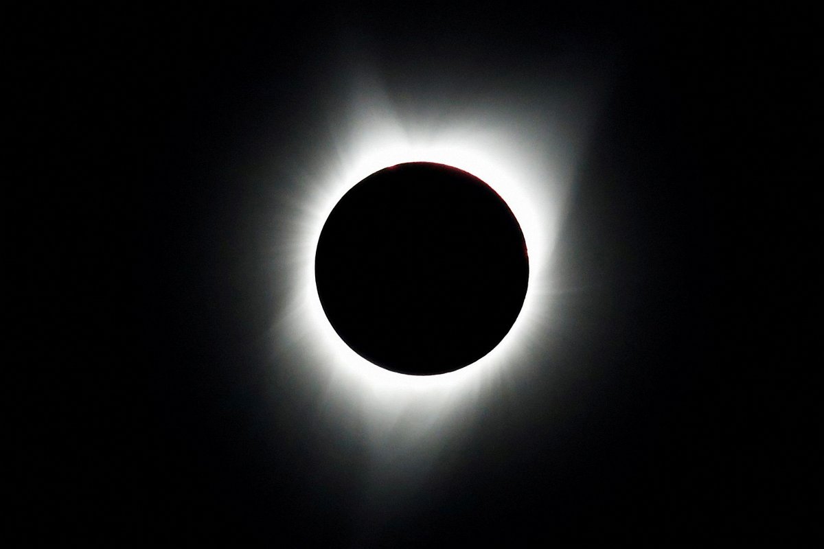 <i>Adrees Latif/Reuters via CNN Newsource</i><br/>The 2017 total solar eclipse is seen over Mitchell