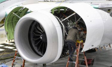 A Boeing employee works on the engine of a 737 MAX on the final assembly line at Boeing's Renton plant. The Federal Aviation Administration has flagged more safety issues for two troubled families of Boeing planes.