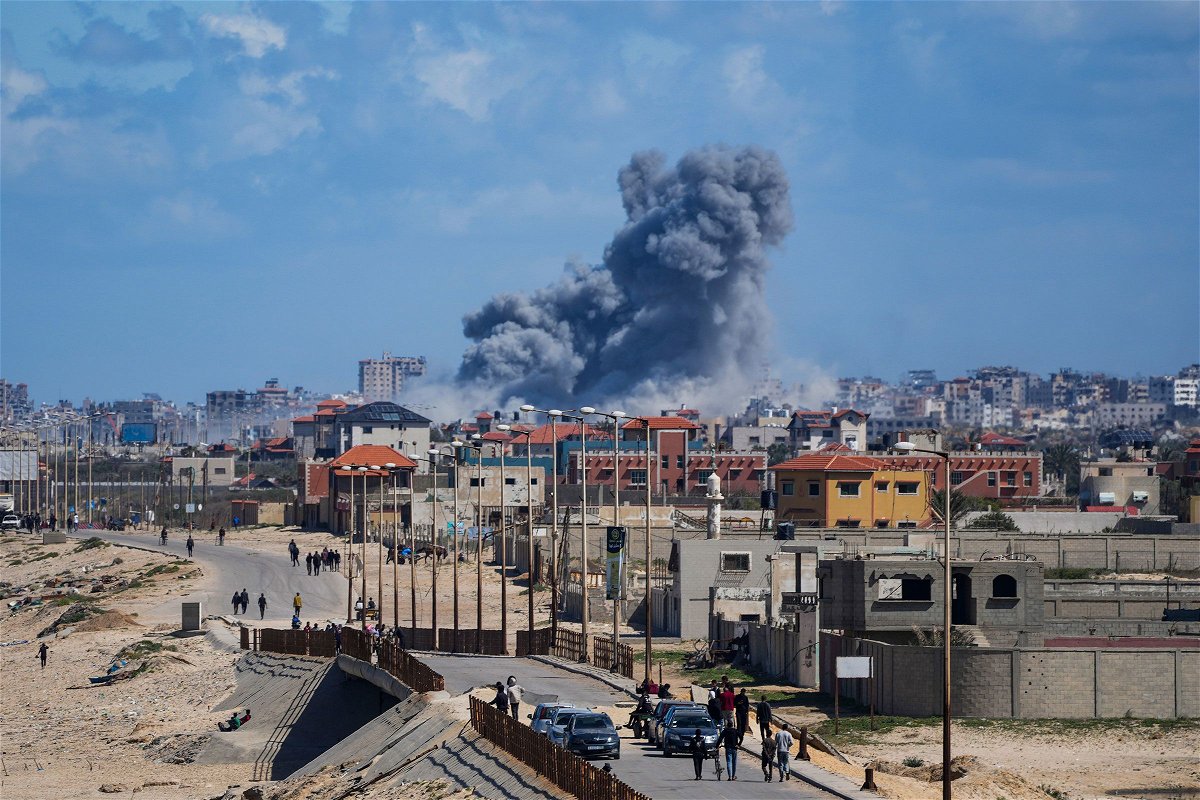 <i>Abdel Kareem Hana/AP via CNN Newsource</i><br/>Smoke rises following an Israeli airstrike in the central Gaza Strip on Friday