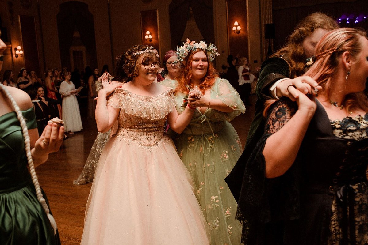 <i>Thistle + Lace Photography via CNN Newsource</i><br/>Guests at a fantasy ball participate in a choreographed dance on August 20