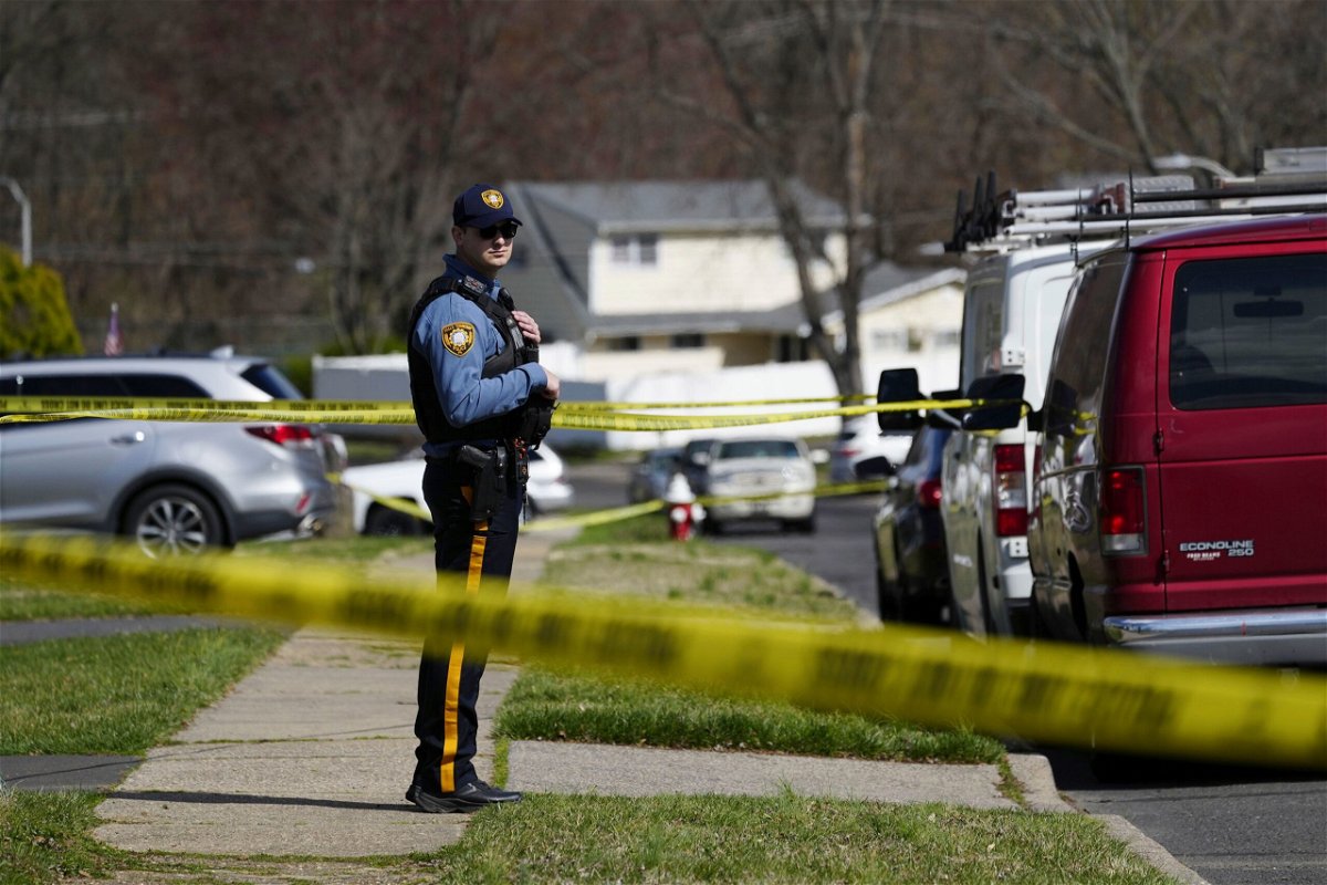 <i>Matt Rourke/AP via CNN Newsource</i><br/>Police respond after a shooting in Levittown