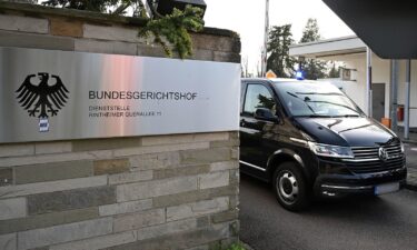 Police vehicles leave the Federal Public Prosecutor's Office at the Federal Court of Justice in Karlsruhe