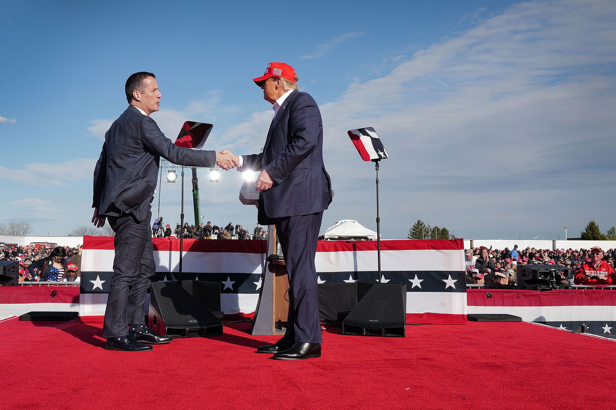 <i>Scott Olson/Getty Images via CNN Newsource</i><br/>Former President Donald Trump greets Moreno during the rally in Vandalia